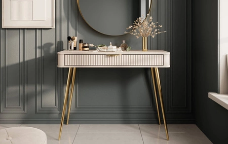 Konsola Lante beżowa z szufladą stylowa oraz funkcjonalna toaletka zaoblony kształt bryły ryflowany front złote dodatki