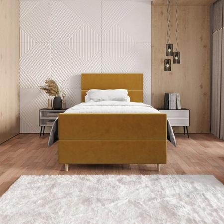 Łóżko kontynentalne Benet 90x200 musztardowe w nowoczesnym skandynawskim stylu z tapicerowanym zagłówkiem oraz zanóżkiem łóżko z pojemnikiem