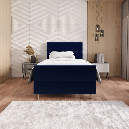 Łóżko kontynentalne Benet 100x200 granatowe w nowoczesnym skandynawskim stylu z tapicerowanym zagłówkiem oraz zanóżkiem łóżko z pojemnikiem