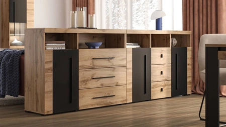 Komoda z szufladami Roger 133 cm dąb wotan / czarny gustowna stylistyka komody wzbogacona o stylowe czarne dodatki idealna do salonu sypialni