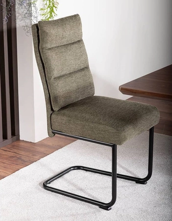 Krzesło tapicerowane Berry oliwkowe nowoczesne oraz funkcjonalne krzesło do jadalni z metalowymi płozami krzesło z uchwytem
