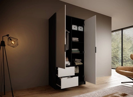 Szafa z lustrem Norel 102 cm czarny / biały stylowa szafa o nowoczesnym designie z ryflowanymi frontami i pojemnymi szufladami