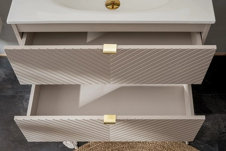 Szafka pod umywalkę Viva 60 cm beżowa nowoczesny design fronty szafki do łazienki z nietuzinkowym frezowaniem w kształcie jodełki