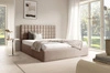 Łóżko tapicerowane Graso 140x200 beżowe nowoczesne i eleganckie łóżko gustowny symetryczny wzór na wezgłowiu pojemnik na pościel