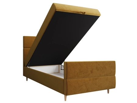 Łóżko kontynentalne Benet 90x200 musztardowe w nowoczesnym skandynawskim stylu z tapicerowanym zagłówkiem oraz zanóżkiem łóżko z pojemnikiem