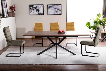 Krzesło tapicerowane Berry żółte nowoczesne oraz funkcjonalne krzesło do jadalni z metalowymi płozami krzesło z uchwytem