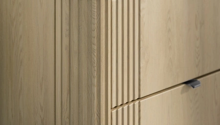 Szafka pod umywalkę Ovalia Cremona 120 cm dąb cremona charakterystyczne zaokrąglone rogi szafki czarne metalowe uchwyty krawędziowe