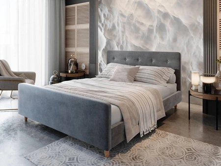 Łóżko tapicerowane Isara 160x200 jasny szary z pojemnikiem w nowoczesnym skandynawskim stylu z charakterystycznym wezgłowiem oraz z zanóżkiem