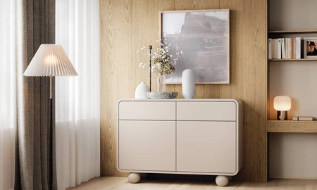 Komoda z szufladami Bion 108 cm beżowa designerska komoda o obłych kształtach oryginalne nogi w kształcie kul przyciągają wzrok