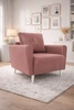 Fotel Felicie łososiowy elegancki fotel do salonu z obszernym i miękkim siedziskiem drewniane nóżki nadają wizualnej lekkości