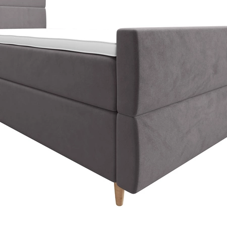 Łóżko kontynentalne Benet 120x200 jasny szary w nowoczesnym skandynawskim stylu z tapicerowanym zagłówkiem oraz zanóżkiem łóżko z pojemnikiem