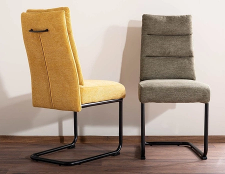 Krzesło tapicerowane Berry oliwkowe nowoczesne oraz funkcjonalne krzesło do jadalni z metalowymi płozami krzesło z uchwytem