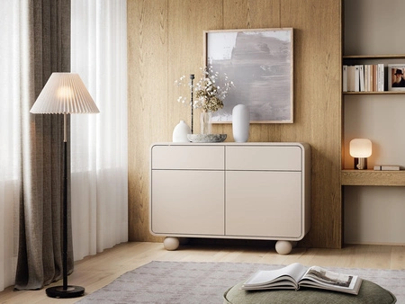 Komoda z szufladami Bion 108 cm beżowa designerska komoda o obłych kształtach oryginalne nogi w kształcie kul przyciągają wzrok