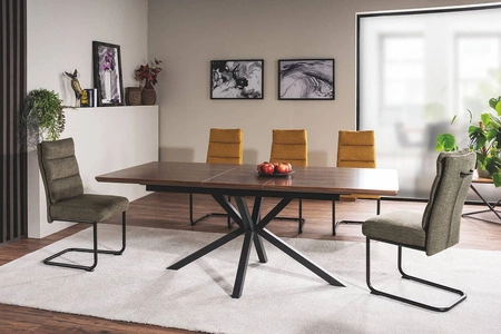 Krzesło tapicerowane Berry oliwkowe nowoczesne oraz funkcjonalne krzesło do jadalni z metalowymi płozami krzesło z uchwytem