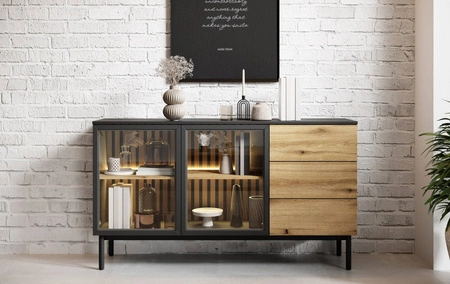 Komoda z szufladami Clovis 150 cm czarny / dąb evoke wyjątkowy design mebla przeszklone fronty ozdobne lamele we wnętrzu komody