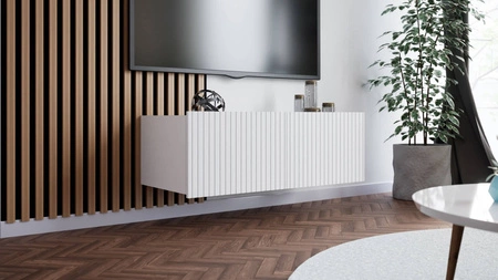 Szafka RTV Colder 100 cm biała z możliwością podwieszenia stylowy ryflowany front elegancka forma mebla w nowoczesnym stylu