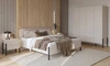 Łóżko Jukon S 180x200 cm beżowe gustowna forma mebla w nowoczesnym stylu łóżko do sypialni na metalowych czarnych nogach z tapicerowanym zagłówkiem