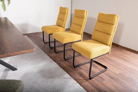 Krzesło tapicerowane Berry żółte nowoczesne oraz funkcjonalne krzesło do jadalni z metalowymi płozami krzesło z uchwytem